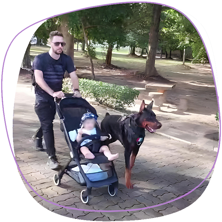 king-rama-ix-park-in-phuket-town-with-baby-in-stroller-and-dog-doberman