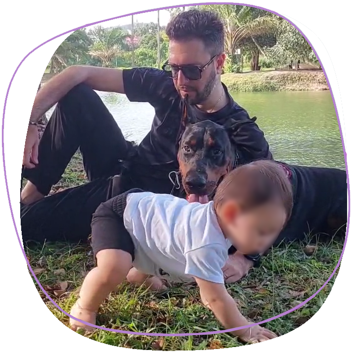 king-rama-9-park-in-phuket-town-with-baby-in-the-grass-and-dog-doberman